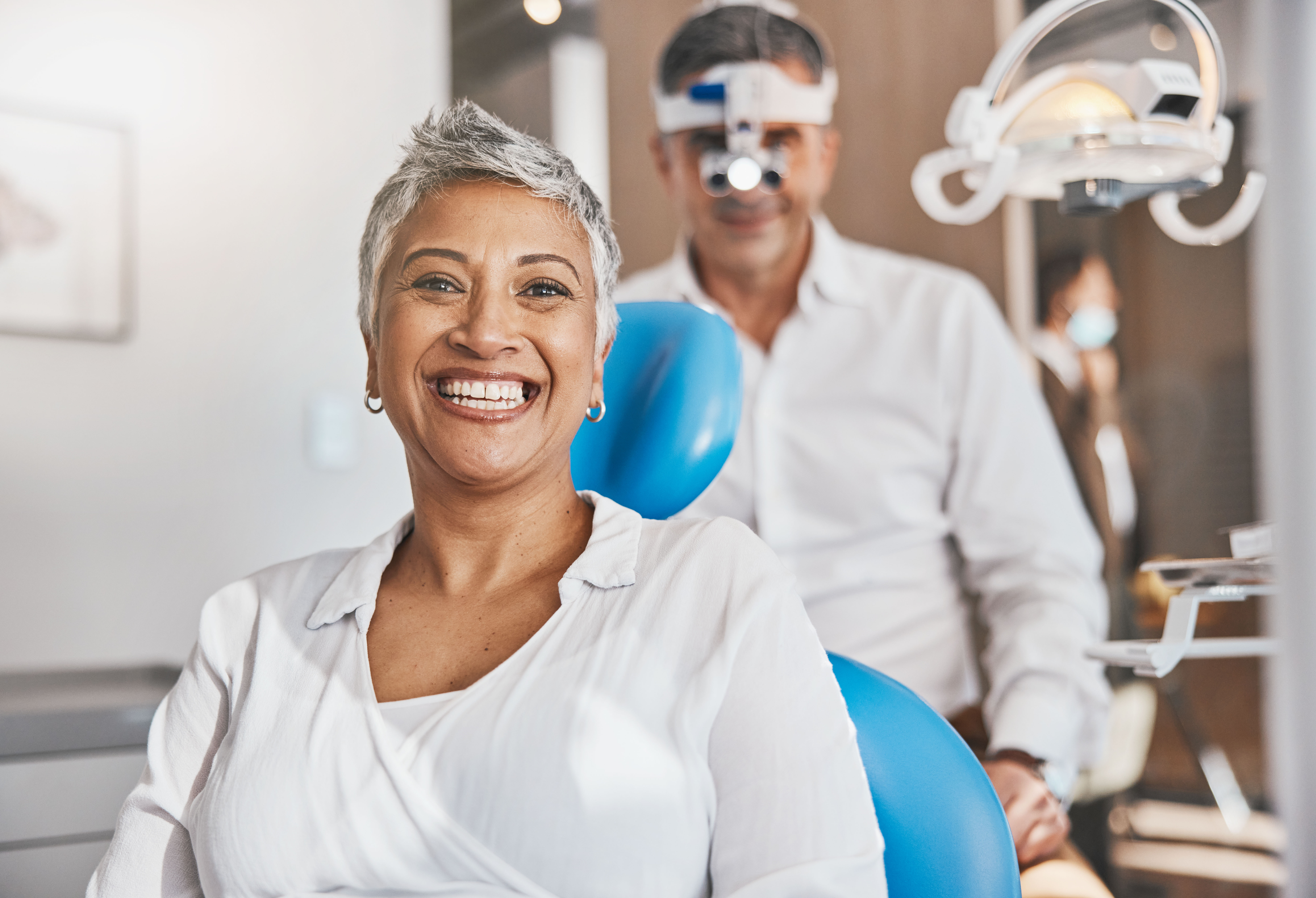 Senior woman smiling in dental office